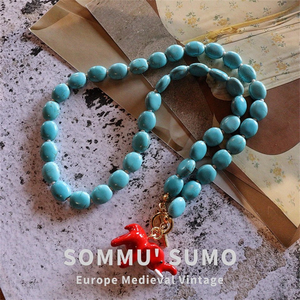 Collar Literario Chapado en Oro Pequeño Elefante Retro Piedra Turquesa Foto 1 de 4