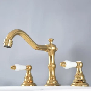 Grifo mezclador de lavabo de baño de latón color dorado con 2 asas y 3 orificios  - Imagen 1 de 9