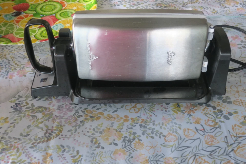 Oster 7 minute grill with timer drip tray 15" X 6" Black  Silver small compact - Image 1 of 4