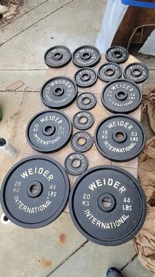 Juego completo placas de pesas Weider International excelente estado. Foto 1 de 4