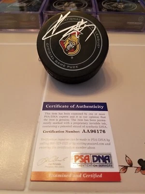 KYLE TURRIS signed SENATORS official game puck PSA/DNA COA - Image 1 of 2