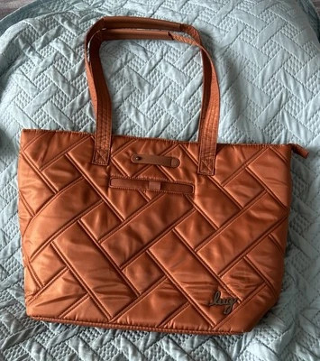 Bolso de Mano Lug Mediano con Manga Trolley Skyliner Cobre Marrón Usado en Excelente Condición Foto 1 de 4