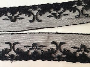 9 1/2 YD SCALLOPED BLACK BEADED CORD FLORAL EMBRDROIDERED ON POLY NET LACE.