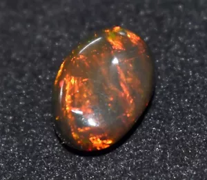 Opale etiope nero naturale 4,75 ct 100% ovale Welo fuoco cabochon pietra preziosa sfusa - Foto 1 di 4