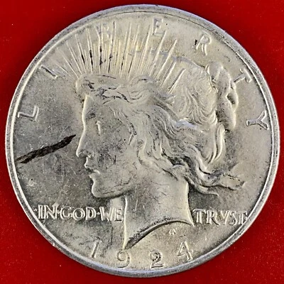 1924 PEACE DOLLAR ROLLED IN SLAG ERROR "LASER EYES" - Image 1 of 2