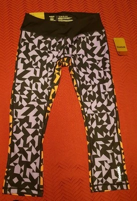 NUEVO CON ETIQUETAS $60 Reebok Sport Activewear Pantalones Capri Ajustados Multicolor Estampado Geométrico XS Foto 1 de 3