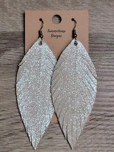 "Orecchini in piuma in vera pelle fatti a mano scintilla champagne 3" - Foto 1 di 2