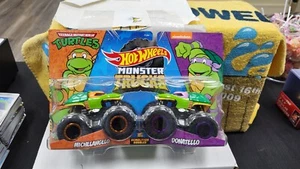 NIB MICHELANGELO DONATELLO DEMOLITION DOUBLES MONSTER TRUCK HOT WHEELS TMNT - Picture 1 of 4