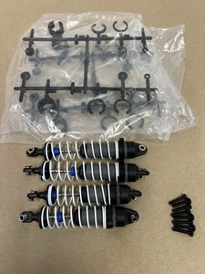 New Traxxas Stampede 4x4 Brushless BL-2s Shocks & Screws - Picture 1 of 4