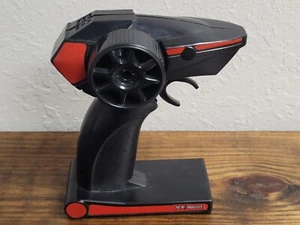New Bright Tumbler Car 2.4 GHz G6DGGH7A Pistol Grip RC Remote Control Black Red - Picture 1 of 6