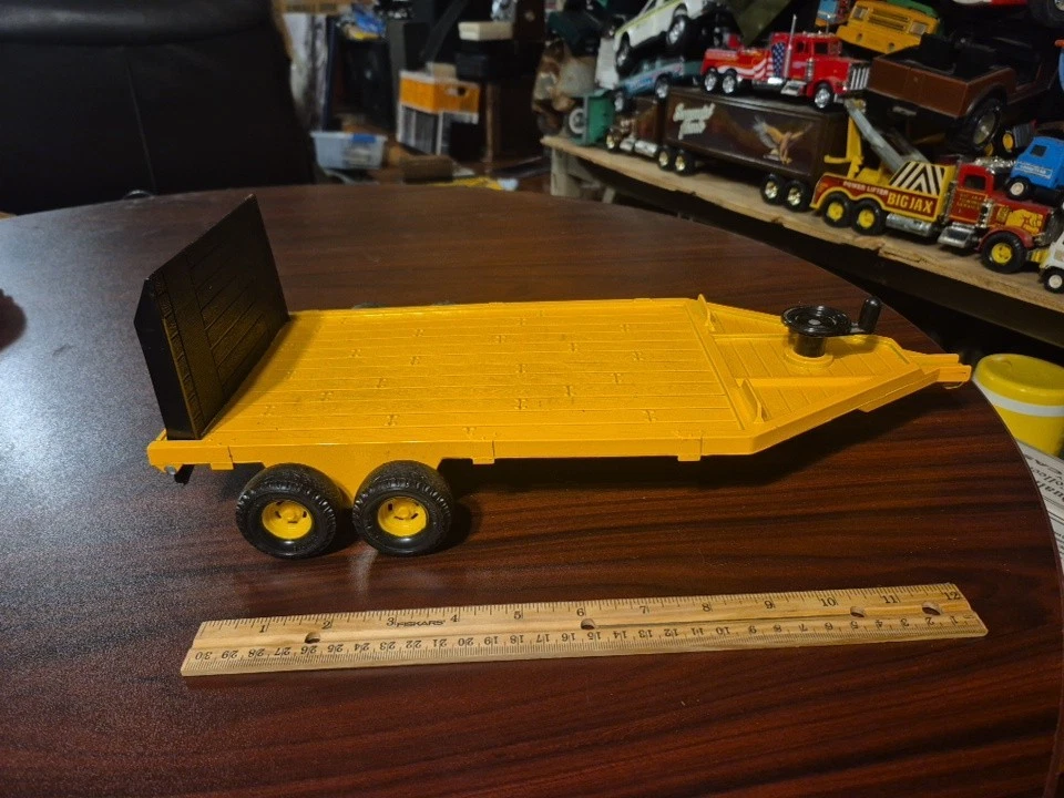 1/16 John Deere Yellow Flatbed Machinery Trailer With Winch - Image 1 of 4