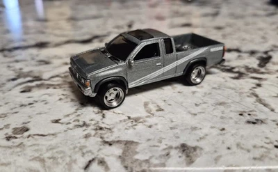 Nissan Harbody D21 Pickup Truck 1/64 - Image 1 of 4