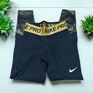 Leggings NIKE PRO Dri-Fit, NEGRO Y DORADO, talla grande para niña, interior suave, 24/26 - Imagen 1 de 11
