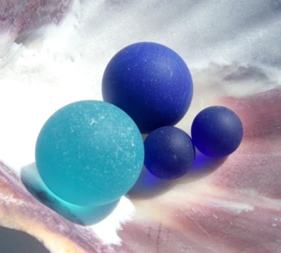 Sea Glass, Collection of Marbles Two Shooters and Two Cobalt Blue - Image 1 of 4