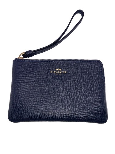 Polsino Coach blu scuro in pelle incrociata con zip angolare