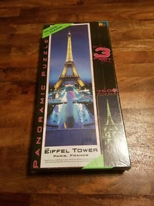 Buffalo Games:The Eiffel Tower Glow In the Dark Panoramic 750 Piece Puzzle (New) - Picture 1 of 12