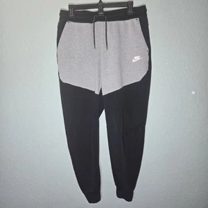 Pantalones deportivos Nike Tech negros grises de vellón para hombre grandes para correr informales - Imagen 1 de 11