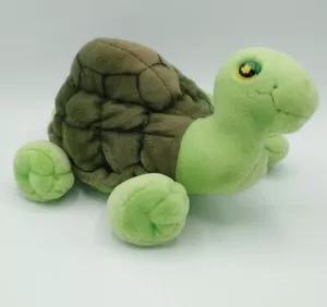 Peluche Aurora Flopsies tartaruga verde scuro conchiglia sdraiato - Foto 1 di 9