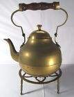 9.5" inch high to handle.Brass teapot kettle on brass trivet