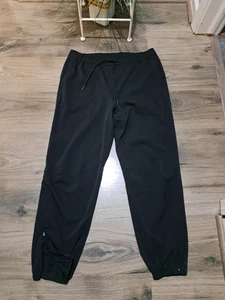 Lululemon schwarze Surge Damen-Jogginghose Windbreaker Stretch Knöchel Reißverschluss Hose 10 - Bild 1 von 8