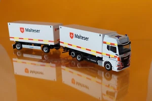 Herpa 318945 MAN TGX GX "Malteser Bad Reichenhall" 1:87 NEU Modellauto - Bild 1 von 2