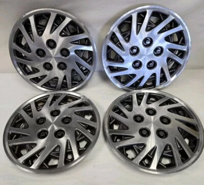 Tapacubos Chrysler Lebaron Dodge Caravan 1993-95 14 pulgadas OEM Mopar Foto 1 de 4