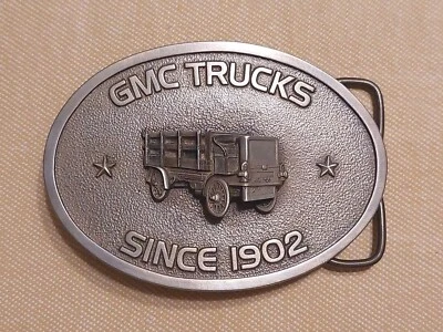 GMC CAMIONES DESDE 1902 BERGAMOTA LATÓN FUNCIONA PELTRE OVALADO DESMONTABLE hebilla de cinturón Foto 1 de 4