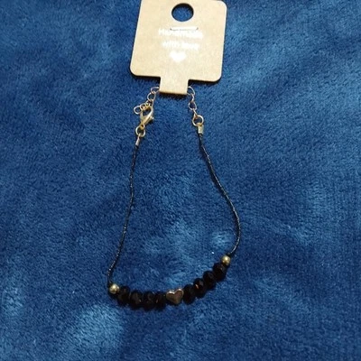 Pulsera de cristal de obsidiana con corazón dorado Foto 1 de 4