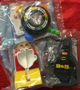 MCDONALD'S BATMAN/BATGIRL TIN PIE FACE BOP IT NEW IN SEALED BAGS - Picture 1 of 2