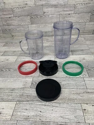 Magic Bullet Cups… 2 Cups With Handles, 2 Lip Rings, 1 Lid And 1 To Go Lid. - Image 1 of 2