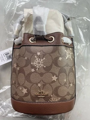 NUEVO CON ETIQUETAS COACH Bolso Bucket para Mujer Sig CC Cuero con Estrella Copo de Nieve SILLA CAQUI Foto 1 de 4