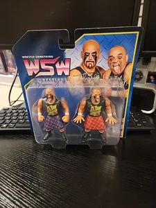 Nuevas colecciones de figuras WWF WWE lucha algo luchadores Headbangers juguetes FC  - Imagen 1 de 6