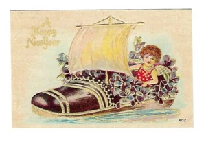 c1906 Fantasía Año Nuevo Postal Niño en un Zapato Velero - En relieve - Imagen 1 de 2