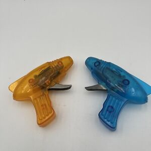 Vintage Pair Of Plastic Friction Toy Ray Guns, One Orange And One Blue 1970’s