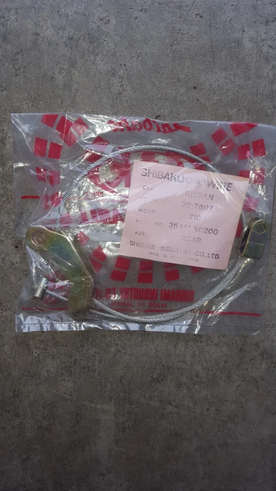 Cable de freno de estacionamiento trasero Datsun freno eléctrico se adapta a 75-77 Nissan 710 140j, 160j nuevo en caja Foto 1 de 2