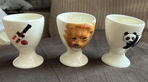 New Oriental Ceramics Ltd OCUK 3 Embossed Eggcups Lion, Panda & Cricket Bat - Picture 1 of 6