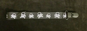 CLIP SOPORTE CALAVERAS CON CHASQUIDO O CUERDA NEGRO - Imagen 1 de 3