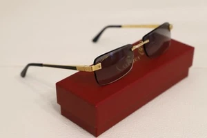 Gafas de sol Cartier unisex doradas de metal sin montura CT0201O 001 - Imagen 1 de 15