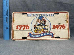 1976 DISNEY AMERICA ON PARADE BICENTENNIAL BOOSTER License Plate - Picture 1 of 2