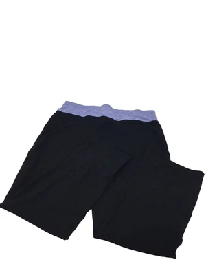 Pantalón acampanado Ideology Performance para mujer, negro/azul, 2X Foto 1 de 2