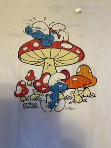 Nueva con etiquetas Camiseta Los Pitufos Champiñón Adulto S Blanca Licencia 100% Algodón - Imagen 1 de 2