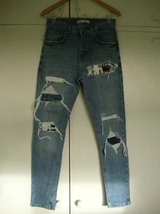 Pantalones de mezclilla ajustados con parche rasgado desgastado azul Zara para hombre - talla 38 EUR - Imagen 1 de 9