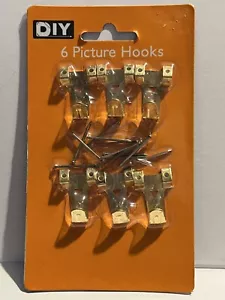 Kit 6 ganci per appendere foto cornice portafoto set chiodi ottone sigillati nuovi - Foto 1 di 6