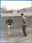 Beautiful girl athlete with a coach at the stadium Vintage photo