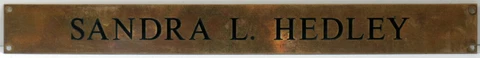 Old bronze brass English plaque sign solicitors office Yorkshire Sandra Hedley Cover