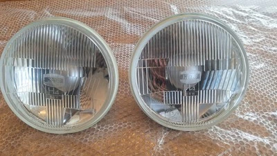 Made in Japan! PAIR of NEW Koito 7" Round Glass Headlight Halogen H4 with bulbs  - Image 1 of 4