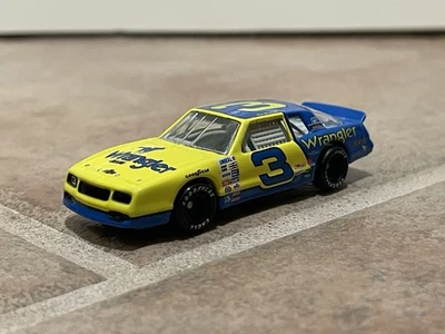 1986 Dale Earnhardt Wrangler Monte Carlo Aerocoupe Champion NASCAR Action 1/64 - Image 1 of 4