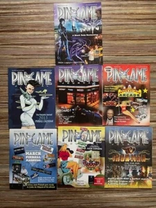 RARE SET OF 7 PIN GAME JOURNAL MAGAZINE TRON AC/DC STERN WIZARD OF OZ PINBALL - Picture 1 of 3