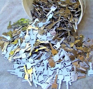 Lot of 100 brass ( Silver color ) GM Key Blanks UN-CUT - Picture 1 of 2