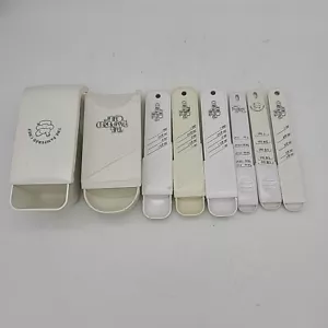8 cucchiai da misurare in plastica bianca regolabili The Pampered Chef vintage - Foto 1 di 11